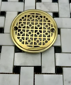 Round Drain in Polished Brass Finish.