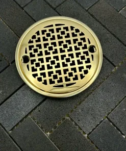 Round Drain in Polished Brass Finish.