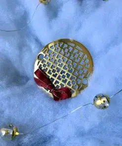 Round Drain in Polished Brass Finish.