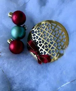 Round Drain in Polished Brass Finish.