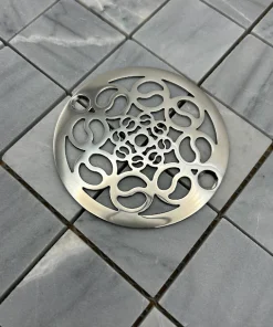 Round drain in Polished stainless steel finish.