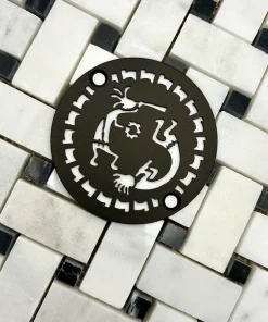 Round drain in kokopelli design in oil rubbed bronze finish.
