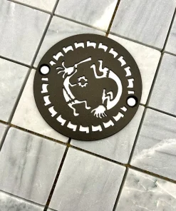 Round drain in kokopelli design in oil rubbed bronze finish.