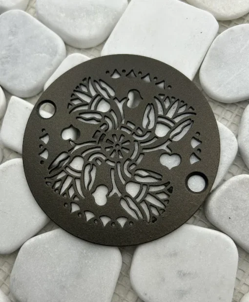 Round drain with an oil rubbed bronze finish.