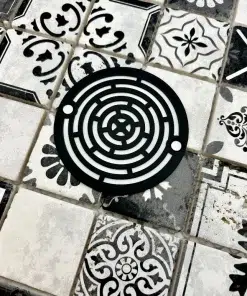 3.25 round drain with maze design in matte black finish.