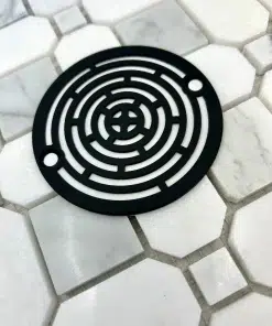 3.25 round drain with maze design in matte black finish.