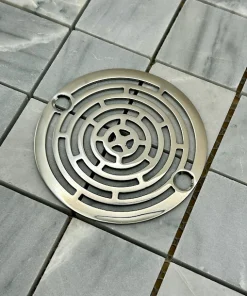 Round drain in Polished stainless steel finish.