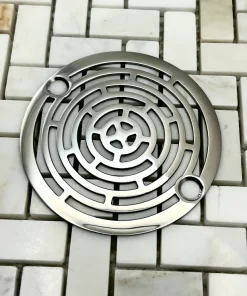 Round drain in Polished stainless steel finish.