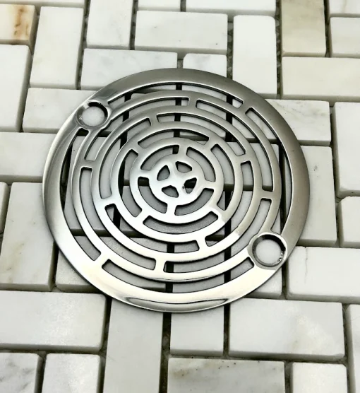 Round drain in Polished stainless steel finish.