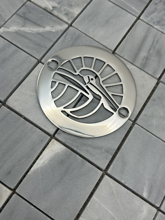 Round drain in Polished stainless steel finish.