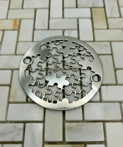 Round drain in Polished stainless steel finish.