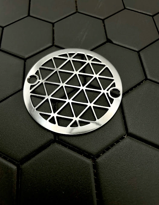 Round drain in Polished stainless steel finish.