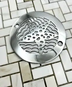 4 in round starfish polished stainless steel in off white tile
