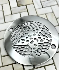 4 in round starfish polished stainless steel in off white tile