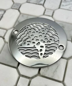 4 in round starfish polished stainless steel on white tile