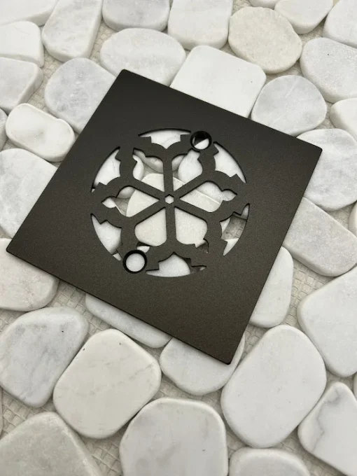 Square drain with oil rubbed bronze finish.