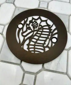 4.25 round seahorse oil rubbed bronze on white tile