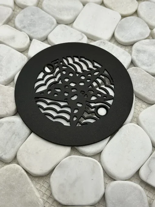 Round drain with oil rubbed bronze finish.