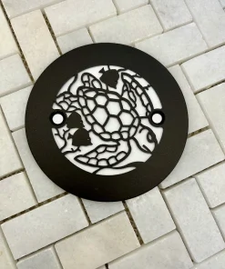 Round drain with turtle design in oil rubbed bronze finish.