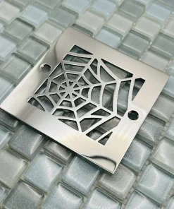 Square drain with polished stainless steel finish.