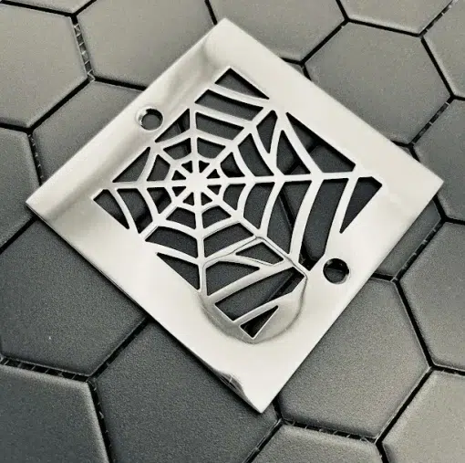 Square drain with polished stainless steel finish.