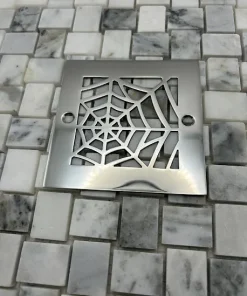 Square drain with polished stainless steel finish.