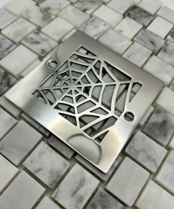 Square drain with polished stainless steel finish.