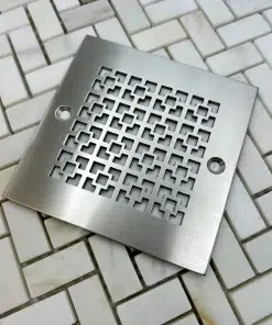 4in square drain with geometric squares 1 design in brushed stainless steel finish.