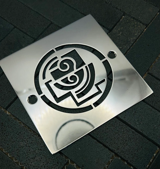 Square drain in Polished stainless steel finish.