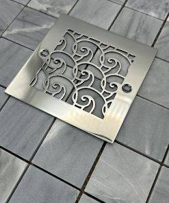 Square drain with polished stainless steel finish.