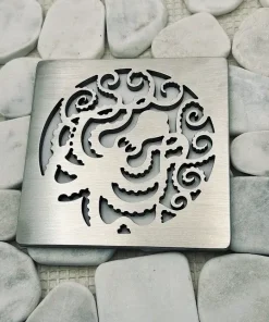 Square shower drain with brushed stainless steel finish.