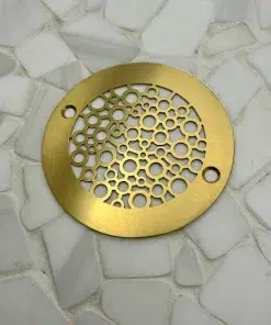 Round drain in a Brushed Brass finish.