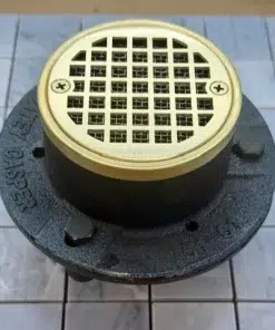 Geometric No. 7, 3.25 inch round unlacquered brass shower drain kit on cast iron rough in.