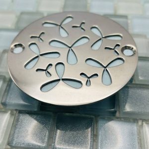 Round drain with polished stainess steel finish.