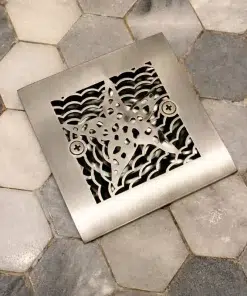 Starfish 4.25 inch square, brushed stainless steel shower drain installation.