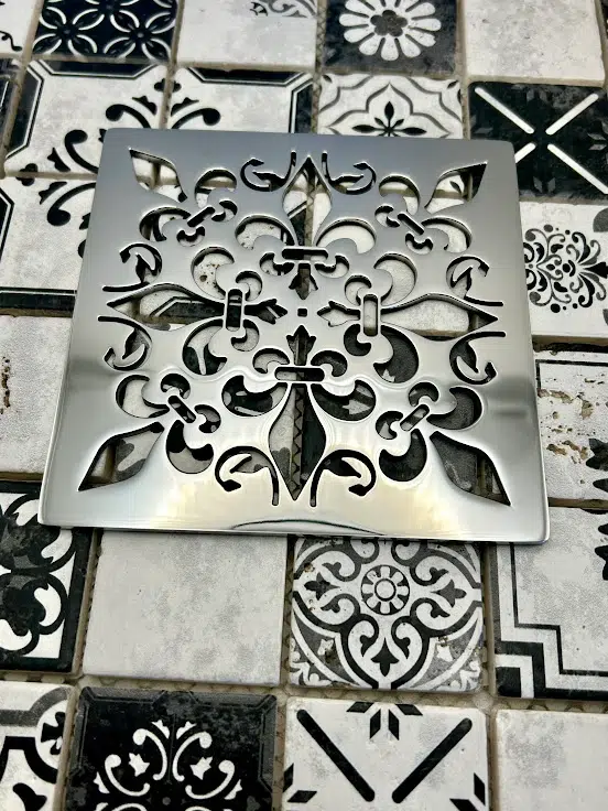 Square drain in Polished stainless steel finish.