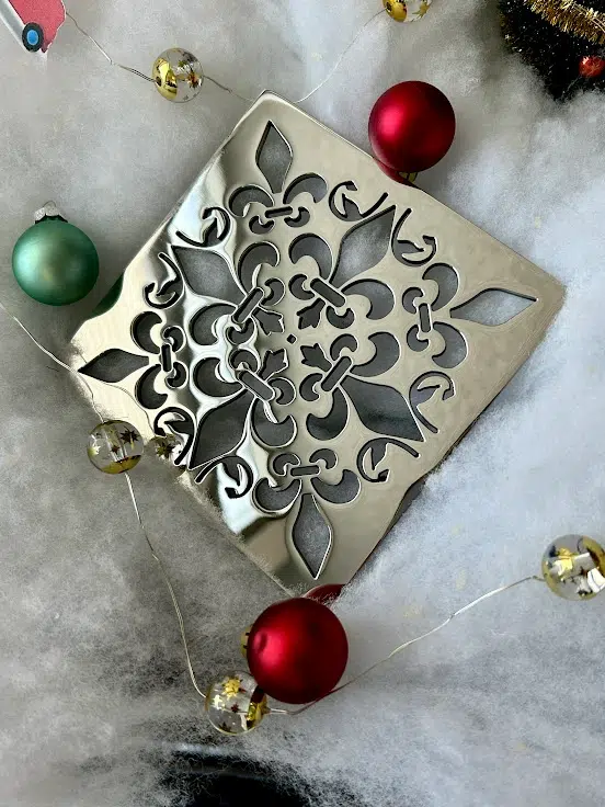 Square drain in Polished stainless steel finish.