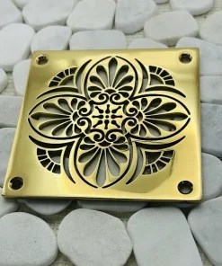 Square drain with polished brass finish.