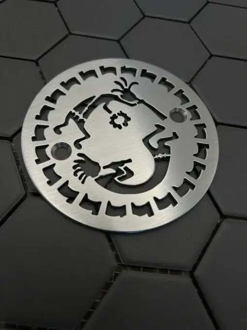 round drain with brushed stainless steel finish.
