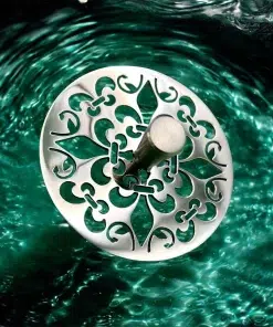 Round sink strainer with fleur de lis design in polished stainless steel finish.