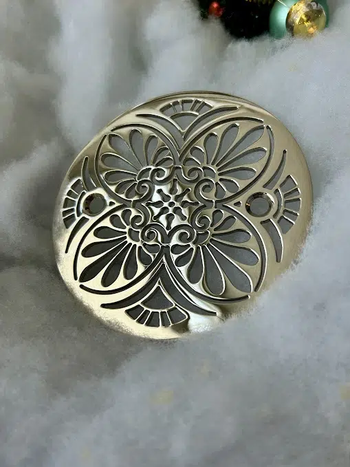 Round Drain in Polished Nickel Finish.