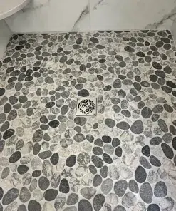 Octopus Schluter drain installation brushed stainless steel by Designer Drains