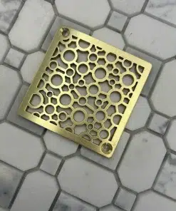 Square drain with unlaquered brushed brass finish.