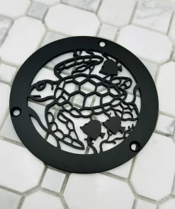 Round drain with matte black finish.
