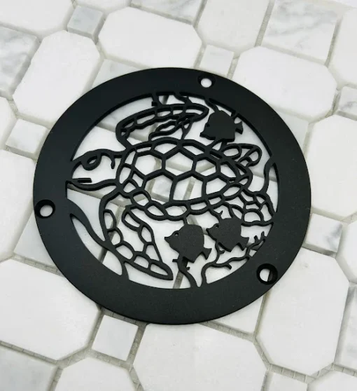 Round drain with matte black finish.