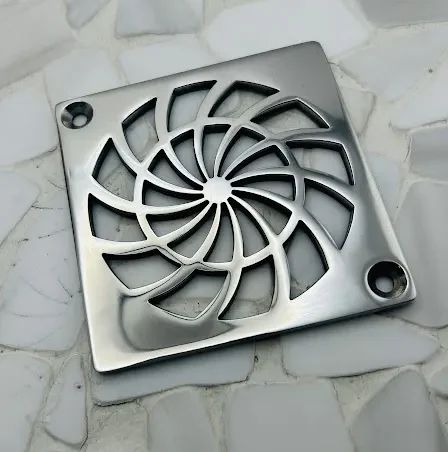 Square drain with polished stainless steel finish.