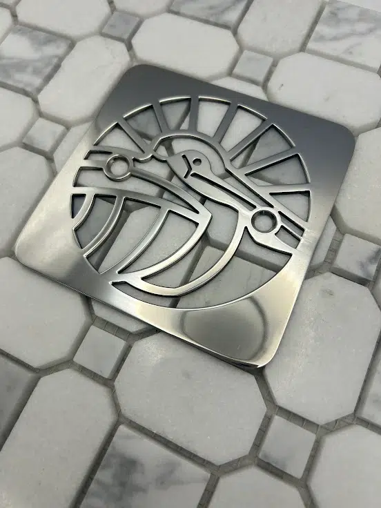 Square drain in Polished stainless steel finish.