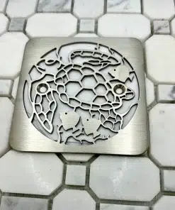 Turtle design in brushed stainless steel finish on white tile. Replacment for Kohler.