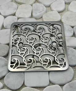 Square drain with polished stainless steel finish.