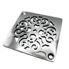 Square drain with Classic Scrolls 4 design in polished stainless steel finish.